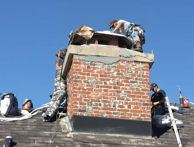 Apopka Chimney Sweep installing a custom chimney crown in Apopka, FL