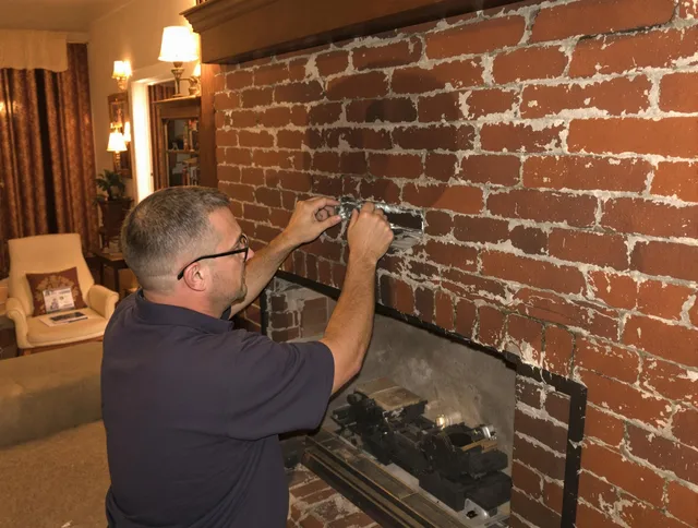 Apopka Chimney Sweep expert fixing a fireplace in Apopka, FL